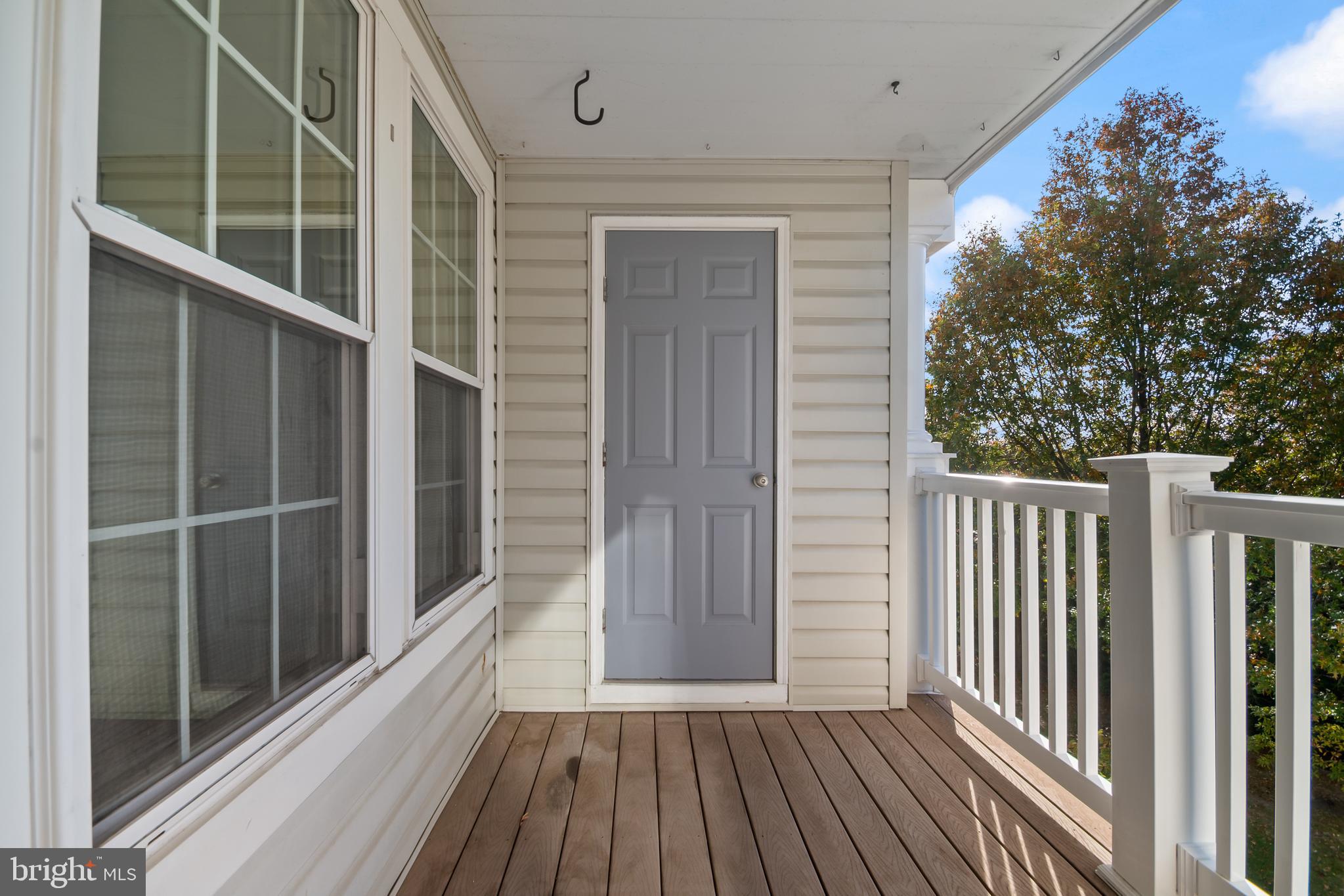 8265 Poplar Mill Road, Unit 8265 Nottingham, MD 21236 - Photo 30 of 35 a view of wooden balcony