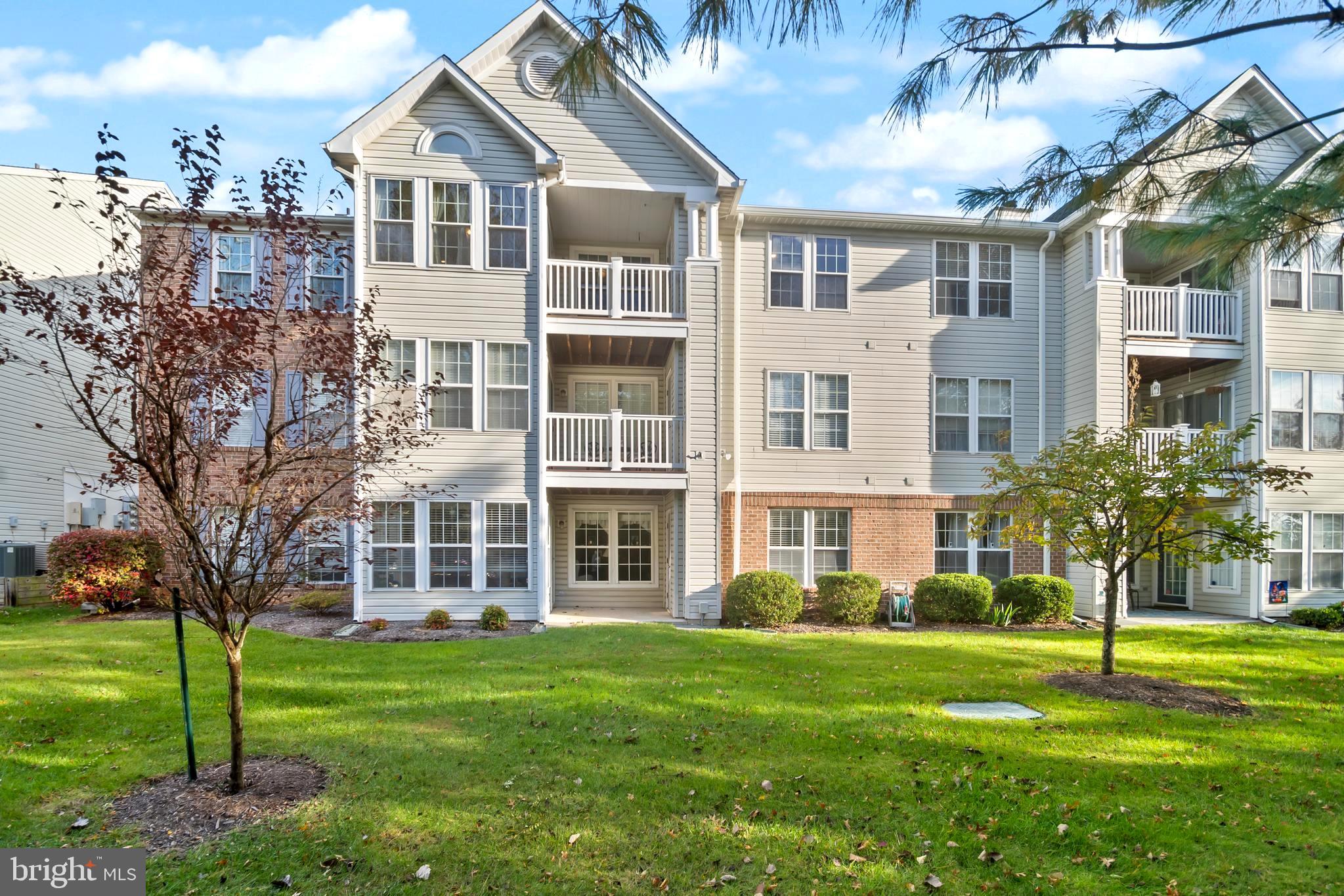 8265 Poplar Mill Road, Unit 8265 Nottingham, MD 21236 - Photo 34 of 35 a front view of a house with a yard