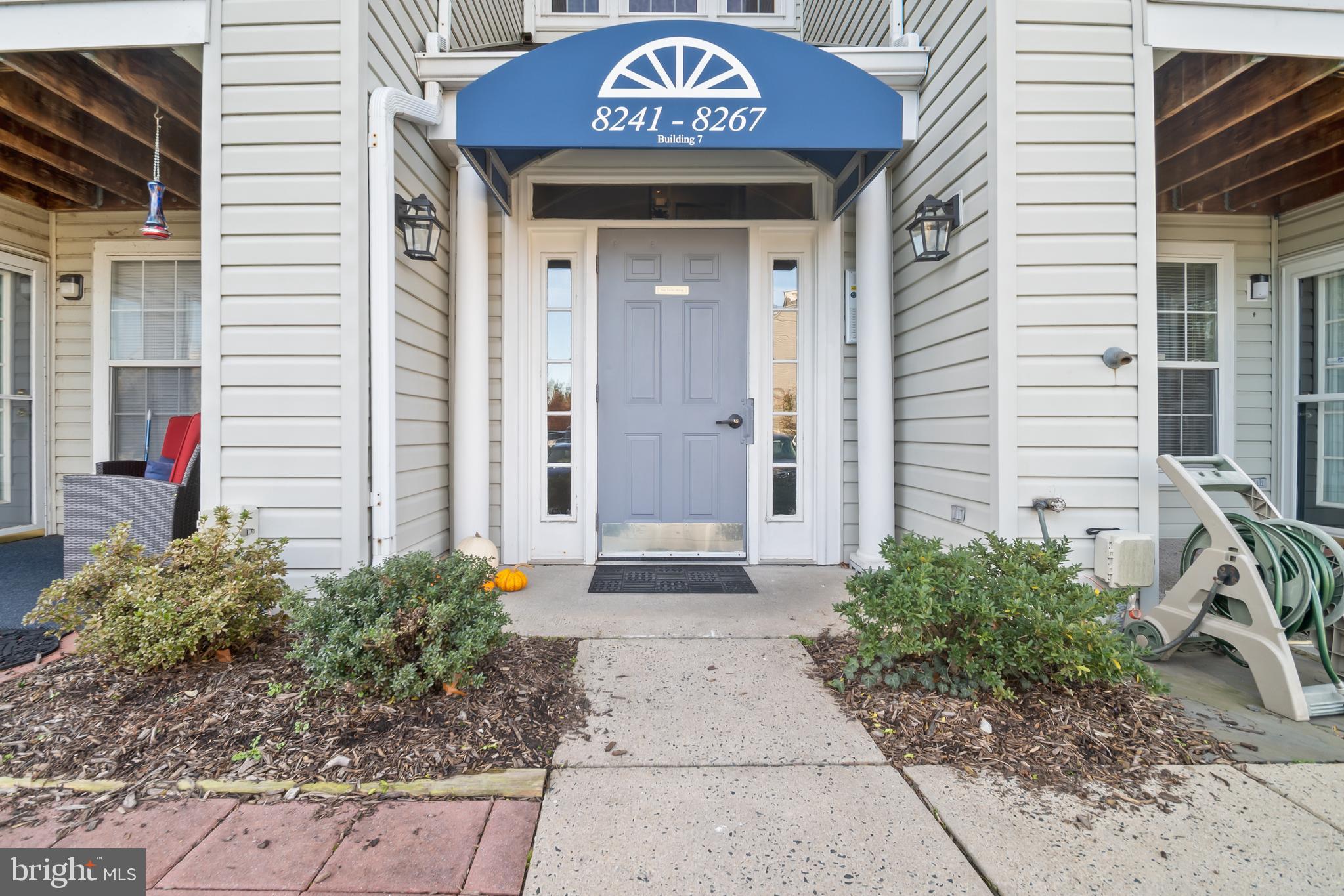 8265 Poplar Mill Road, Unit 8265 Nottingham, MD 21236 - Photo 35 of 35 a sign board with a small yard