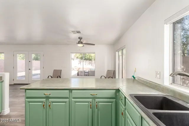 a kitchen with a sink and a window