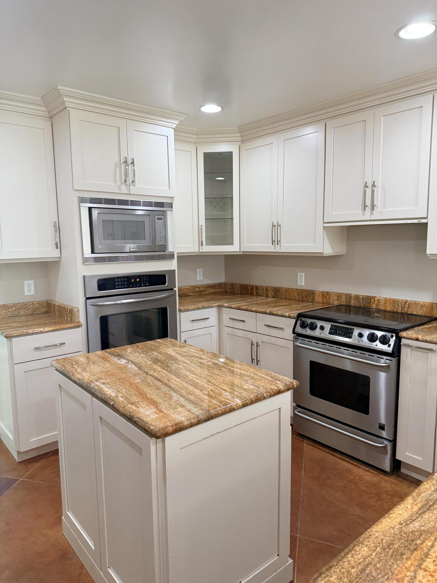255 Ridge Lake Road Crestview, FL 32536 - Photo 12 of 39 a kitchen with granite countertop a sink stove and oven