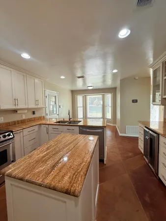 a kitchen with a sink and a window