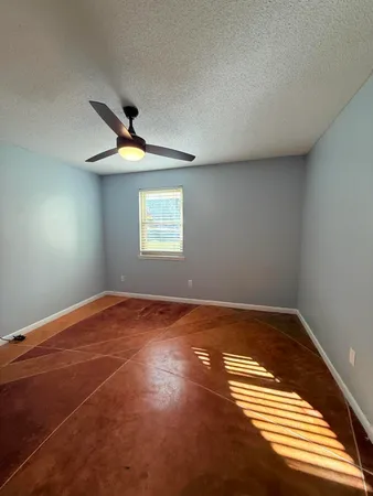 a spacious bathroom with a double vanity sink and mirror