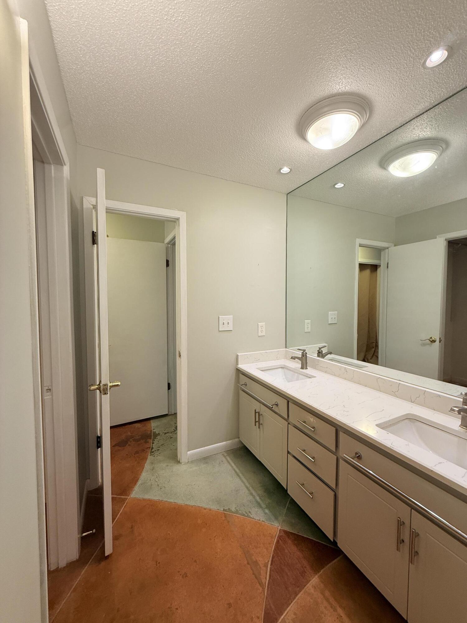 255 Ridge Lake Road Crestview, FL 32536 - Photo 22 of 39 a spacious bathroom with a double vanity sink and mirror