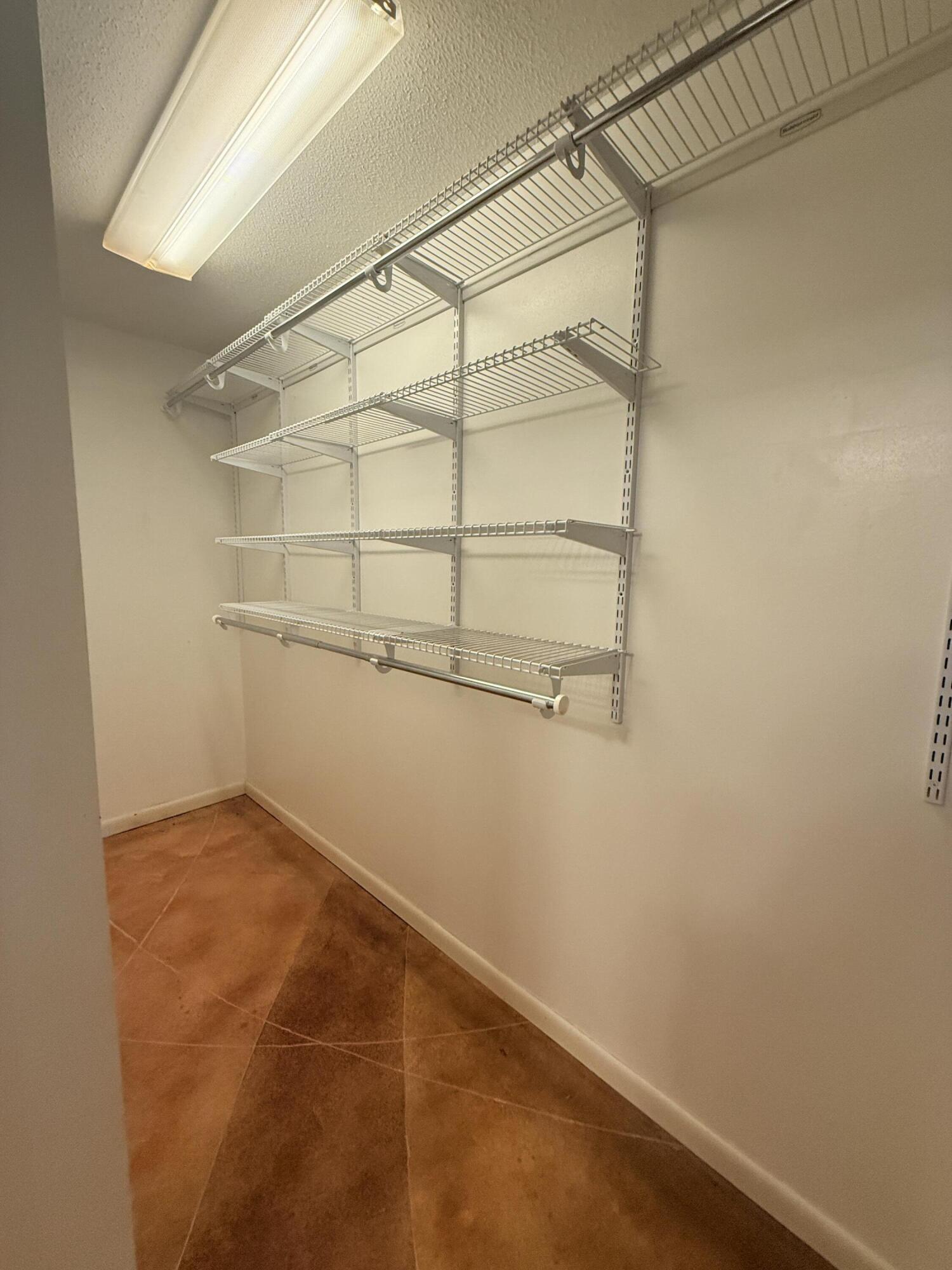 255 Ridge Lake Road Crestview, FL 32536 - Photo 27 of 39 a view of a room with racks on the wall