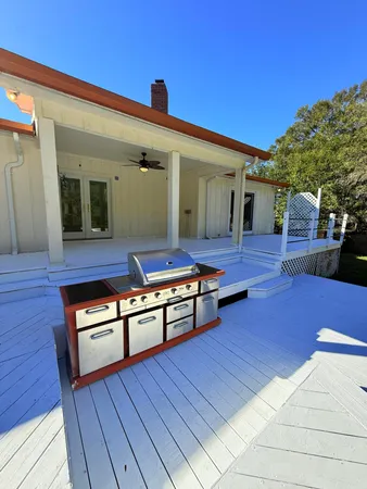 a view of a swimming pool with an outdoor space and seating area