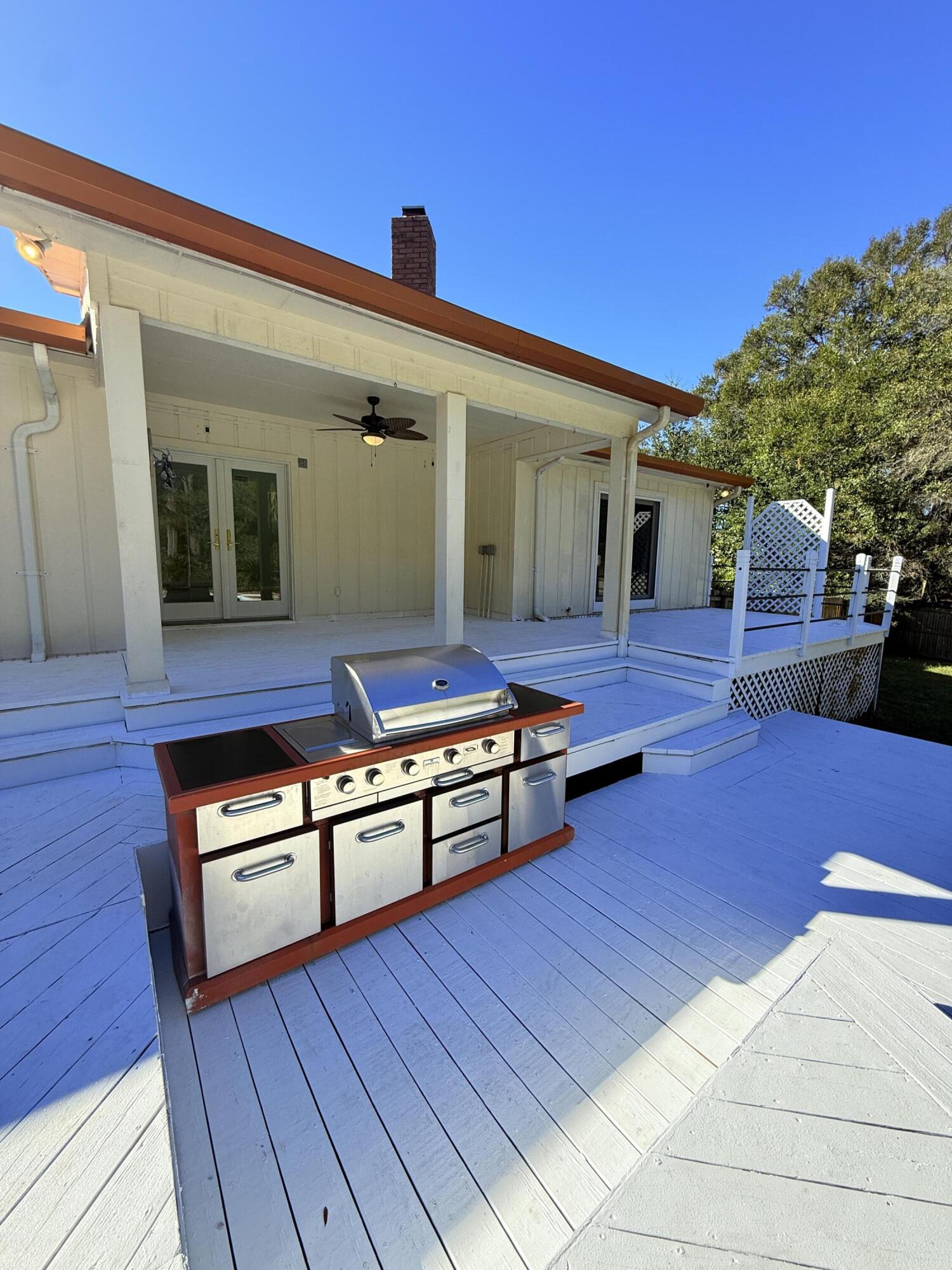 255 Ridge Lake Road Crestview, FL 32536 - Photo 33 of 39 a living room with couches chairs and wooden floor