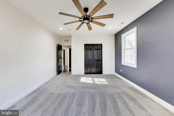 a bathroom with a granite countertop sink