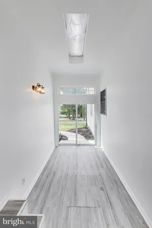 a bathroom with a granite countertop shower and a sink