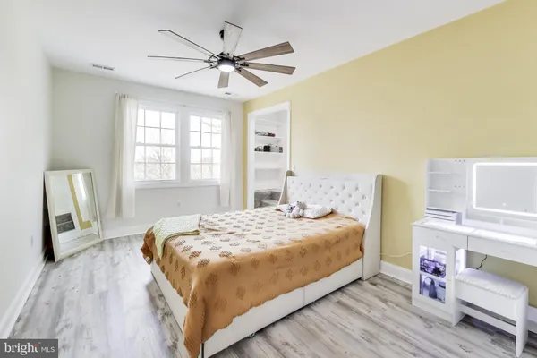 a kitchen with stainless steel appliances granite countertop a refrigerator stove and microwave