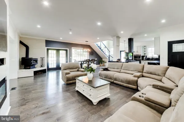 a kitchen with stainless steel appliances granite countertop a stove sink and cabinets