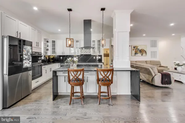 a view of a livingroom with furniture and a wooden floor