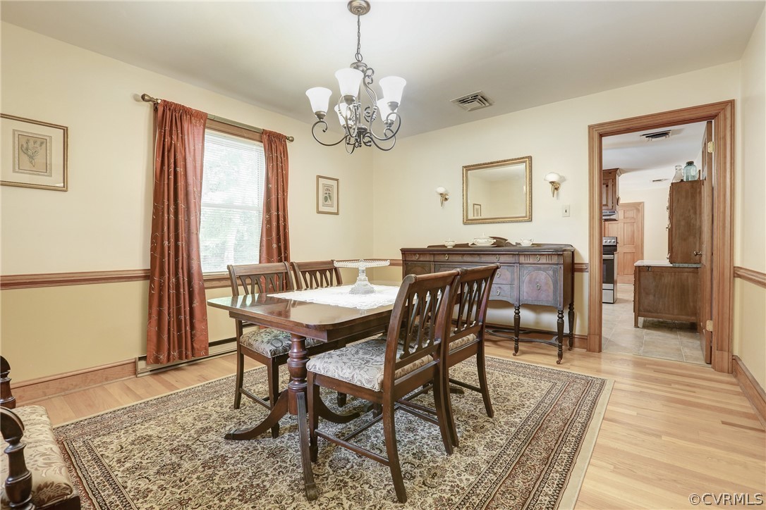 7401 Old Roxbury Road Quinton, VA 23141 - Photo 10 of 32 Formal Dining Room with Hardwood Floors and Chair
