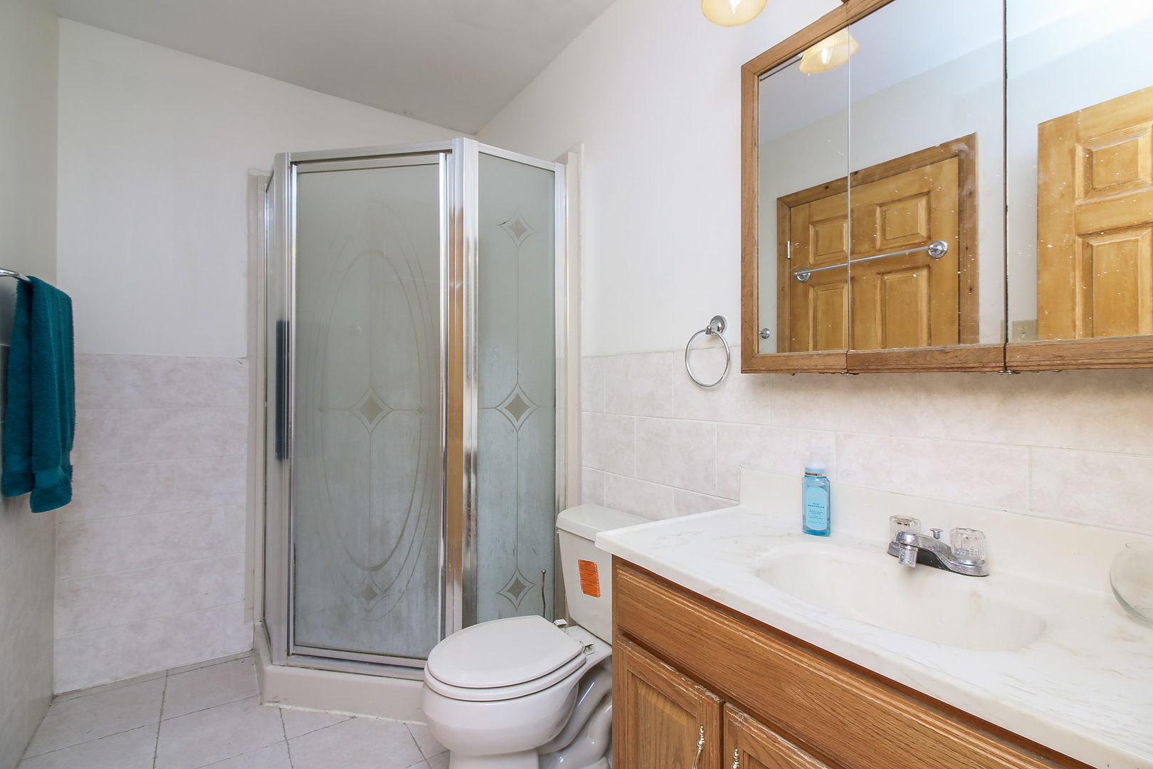 1128 South Wolf Road Des Plaines, IL 60016 - Photo 15 of 20 a bathroom with a granite countertop sink toilet and shower