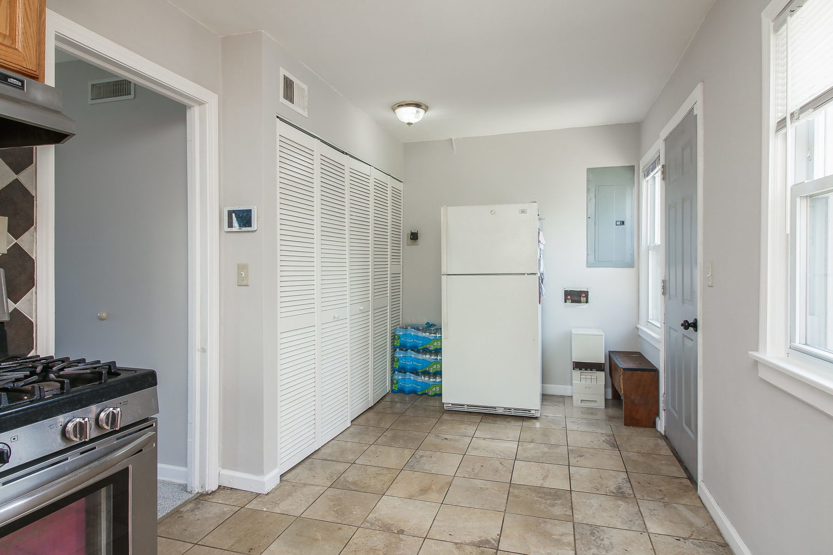 1128 South Wolf Road Des Plaines, IL 60016 - Photo 7 of 20 a view of a kitchen with refrigerator and stove