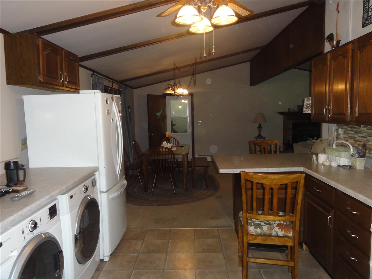 14913 Prairie Road Rockton, IL 61072 - Photo 12 of 19 a view of a kitchen with furniture and a fireplace