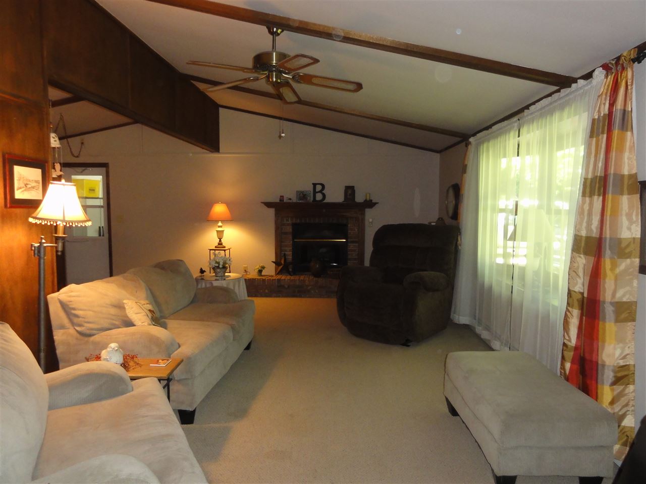 14913 Prairie Road Rockton, IL 61072 - Photo 7 of 19 a living room with furniture and a flat screen tv