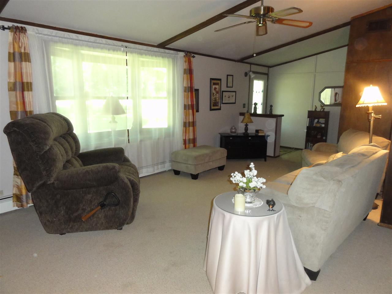14913 Prairie Road Rockton, IL 61072 - Photo 8 of 19 a living room with furniture chandelier and a large window