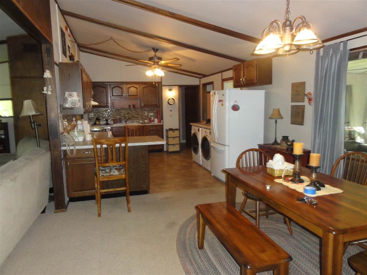 14913 Prairie Road Rockton, IL 61072 - Photo 10 of 19 a view of a livingroom with furniture and a chandelier