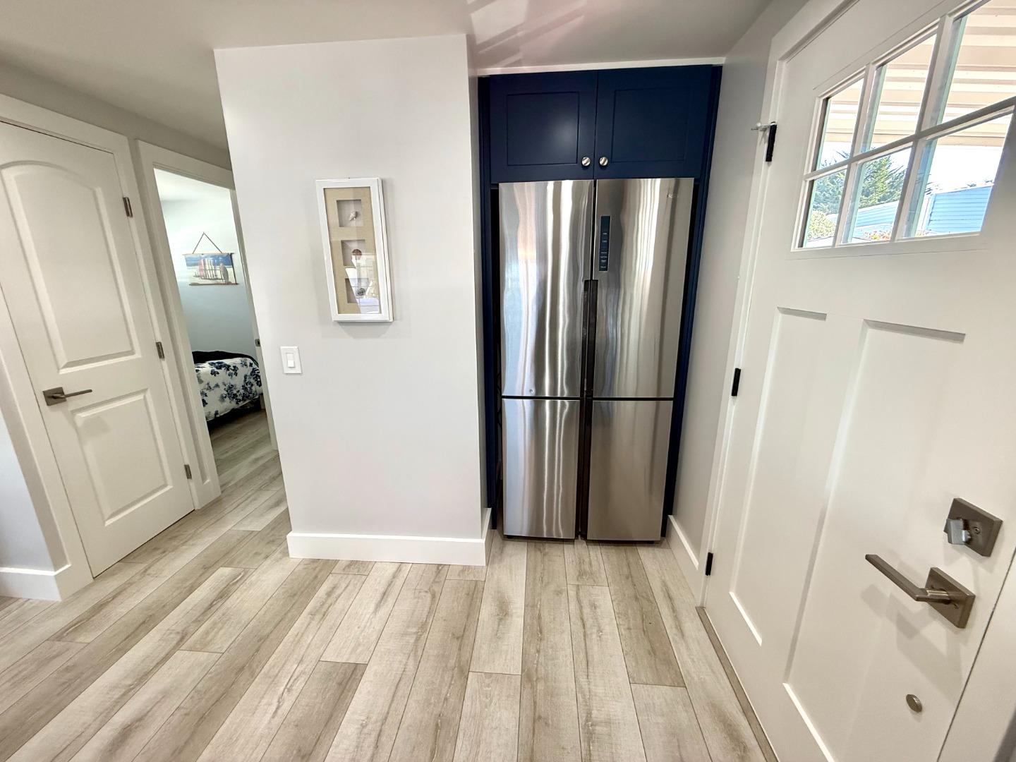 8 Lighthouse Road, Unit 8 Half Moon Bay, CA 94019 - Photo 4 of 21 a view of a refrigerator in a kitchen
