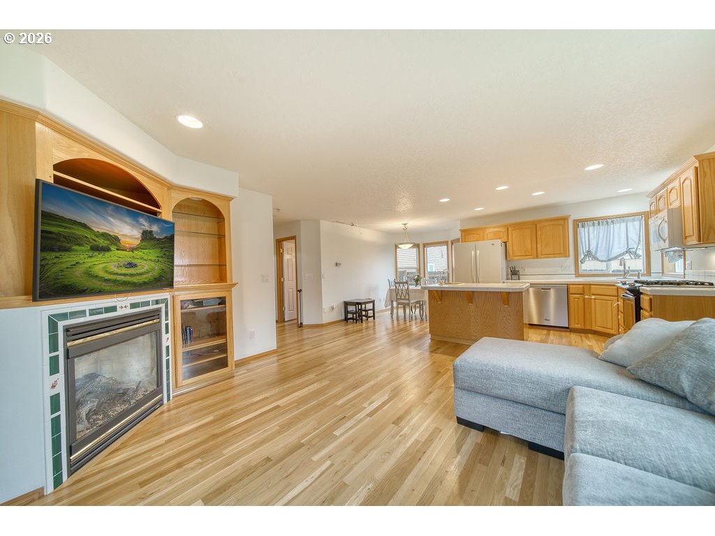 34672 Cascade Street St. Helens, OR 97051 - Photo 13 of 42 a living room with furniture wooden floor and a flat screen tv