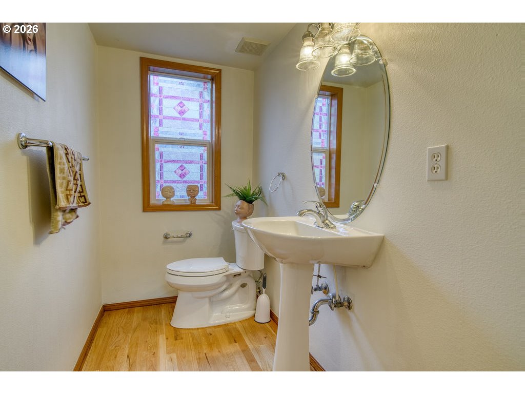 34672 Cascade Street St. Helens, OR 97051 - Photo 16 of 42 a bathroom with a toilet a sink and mirror