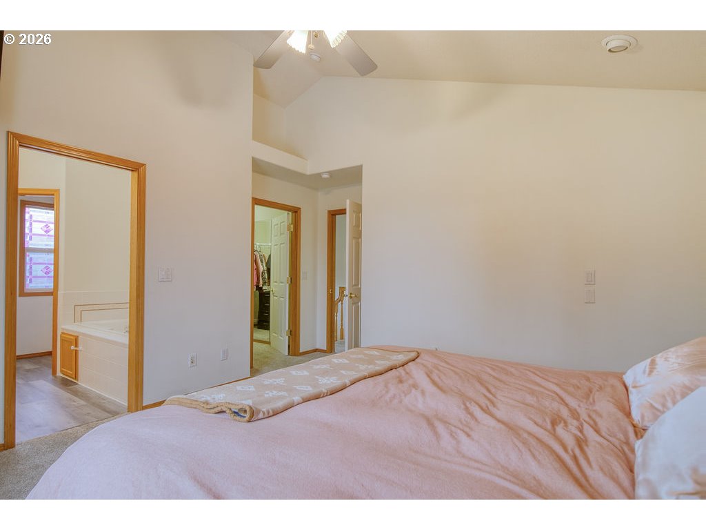 34672 Cascade Street St. Helens, OR 97051 - Photo 20 of 42 a bedroom with a bed and wooden floor