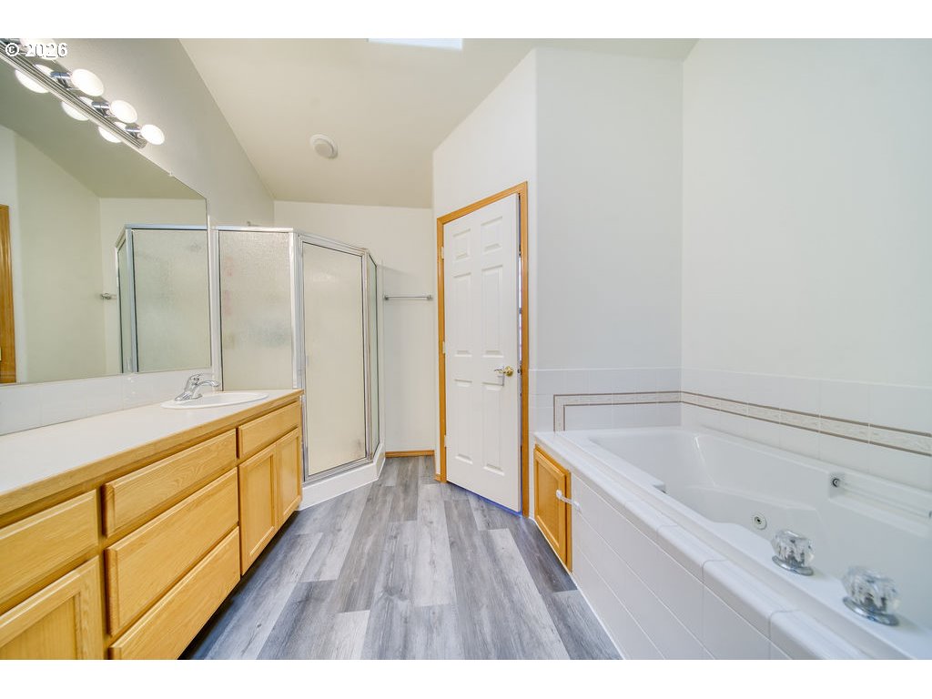34672 Cascade Street St. Helens, OR 97051 - Photo 21 of 42 a bathroom with a bathtub and a double vanity sink