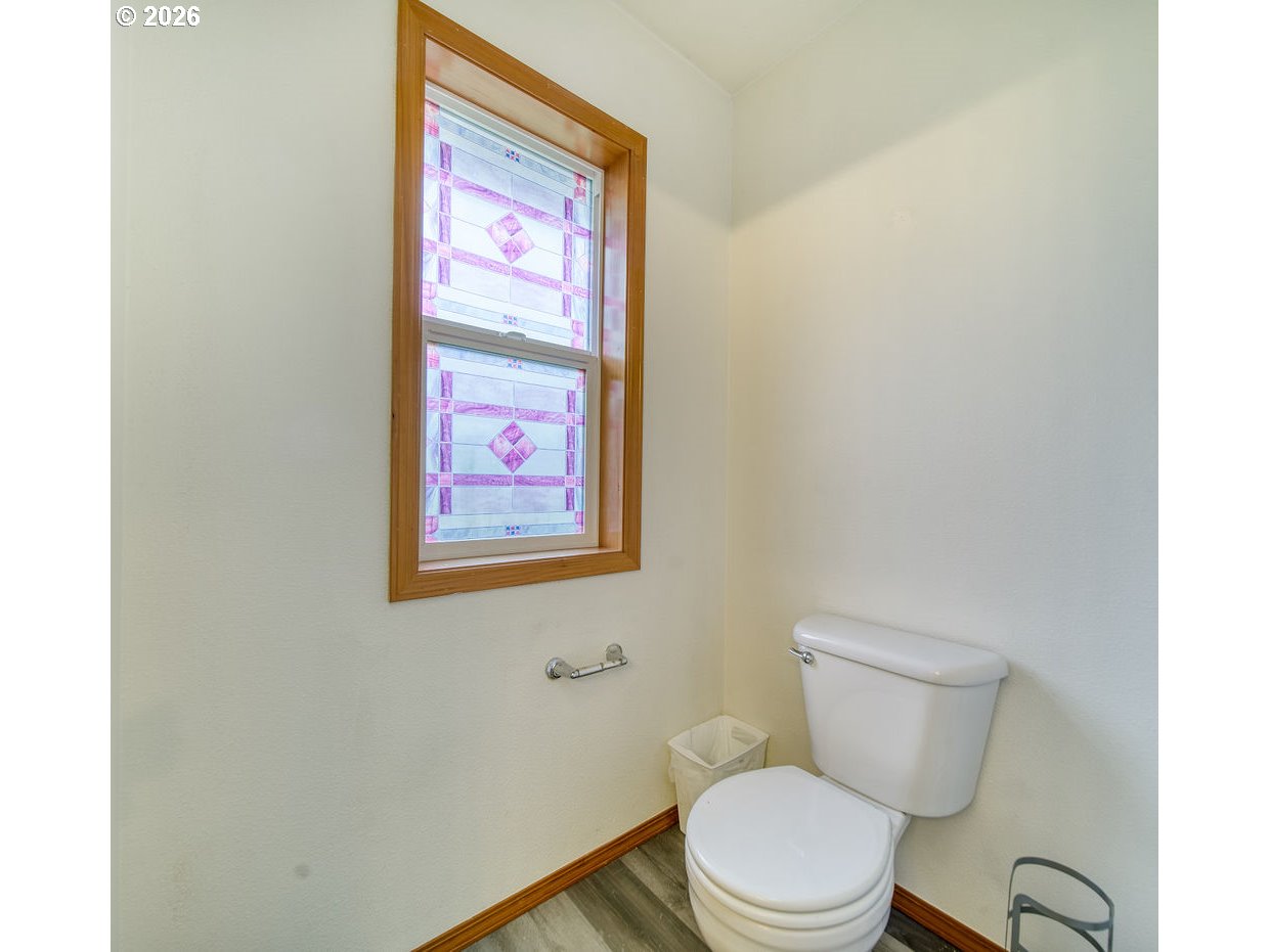 34672 Cascade Street St. Helens, OR 97051 - Photo 25 of 42 a white toilet sitting next to a small bathroom