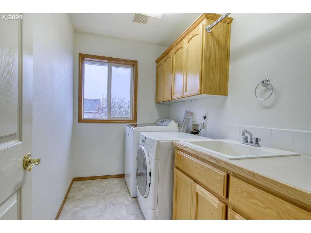 34672 Cascade Street St. Helens, OR 97051 - Photo 30 of 42 a utility room with a sink dryer and washer