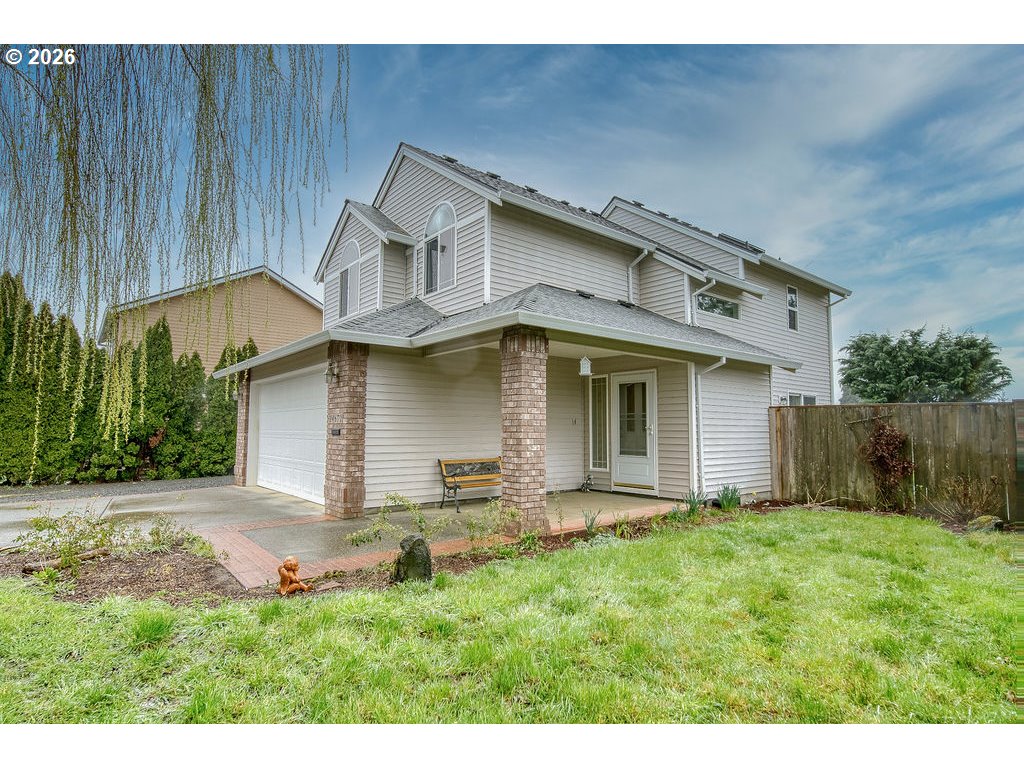 34672 Cascade Street St. Helens, OR 97051 - Photo 3 of 42 a front view of a house with a yard and garage