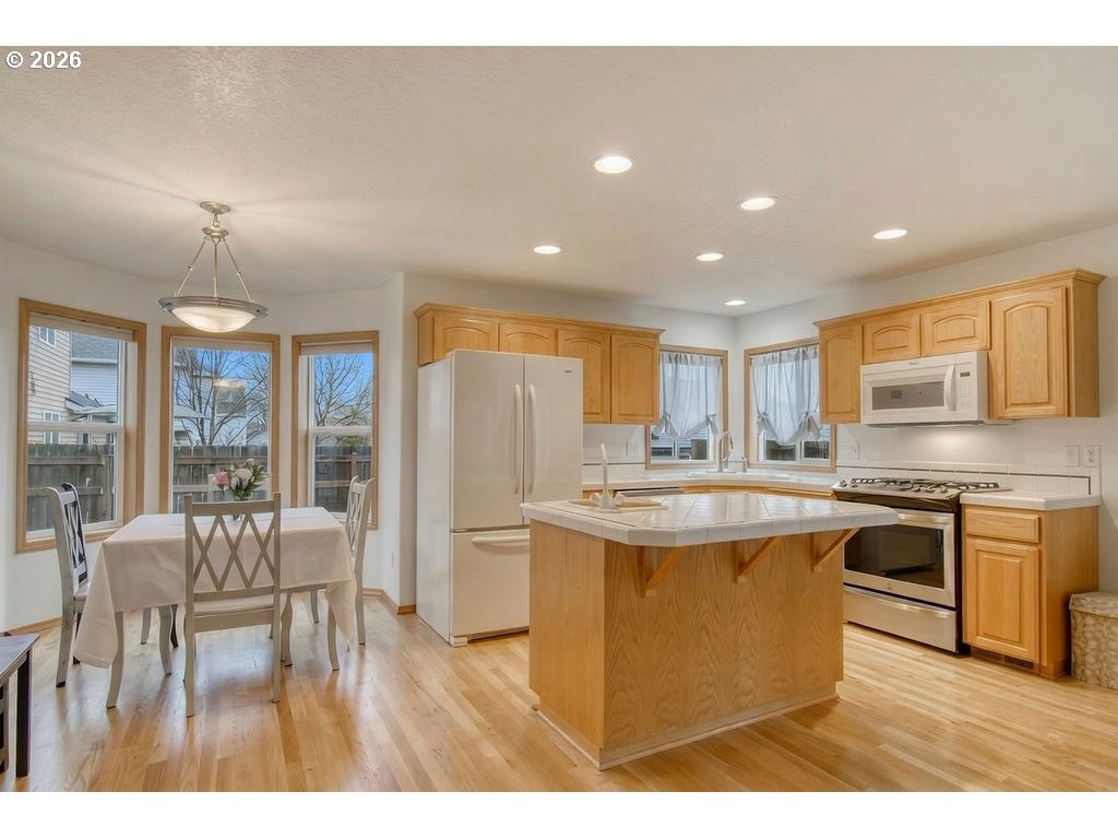 34672 Cascade Street St. Helens, OR 97051 - Photo 32 of 42 a kitchen with stainless steel appliances granite countertop a stove and a refrigerator