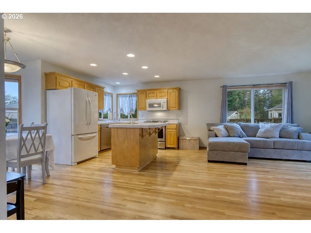 34672 Cascade Street St. Helens, OR 97051 - Photo 8 of 42 a living room with furniture and kitchen view