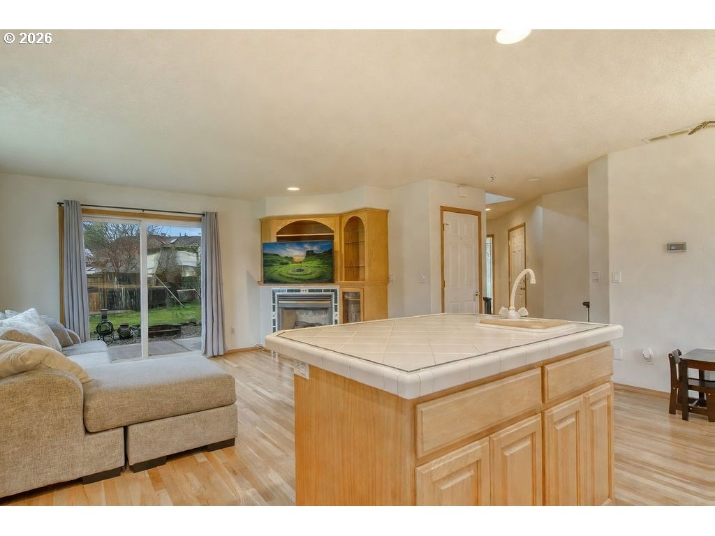 34672 Cascade Street St. Helens, OR 97051 - Photo 9 of 42 a living room with furniture a large window and kitchen view