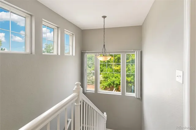 a view of a hallway with a window