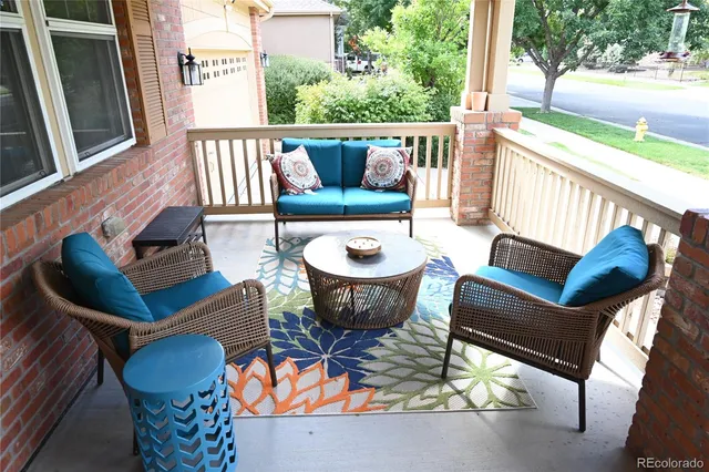 a view of balcony with couple of chairs