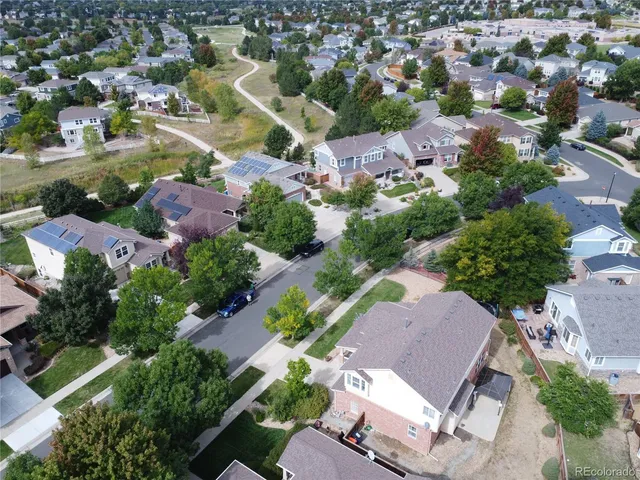 an aerial view of residential houses with outdoor space