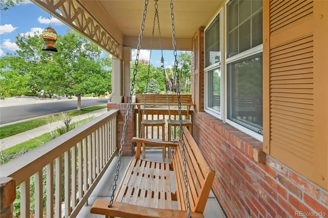 a view of a balcony with wooden floor