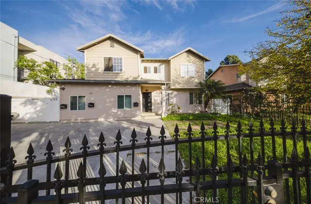 a front view of a house with a yard table and chairs