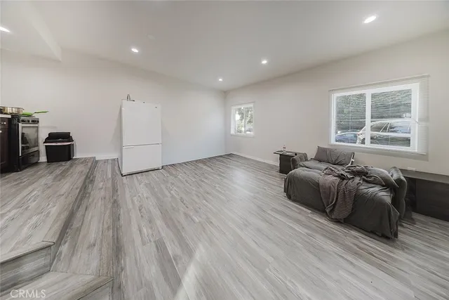 a room with furniture and a wooden floor