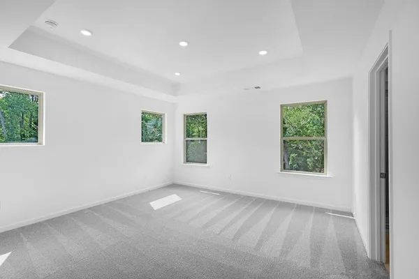a bathroom with a double vanity sink mirror and shower