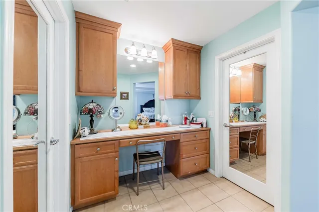 a spacious bathroom with a tub sink and mirror