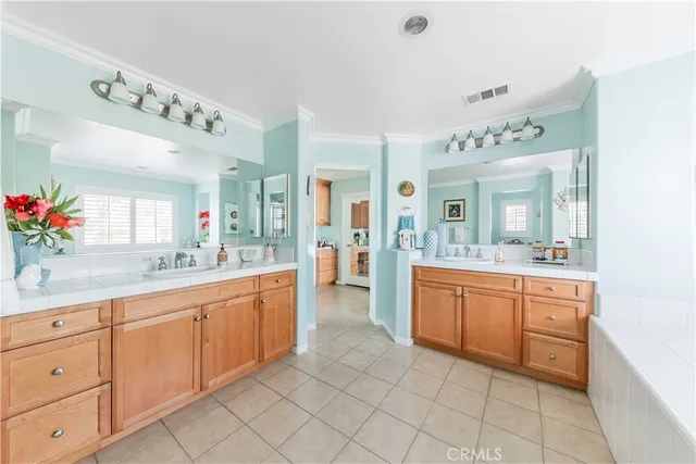 a living room with furniture and a ceiling fan