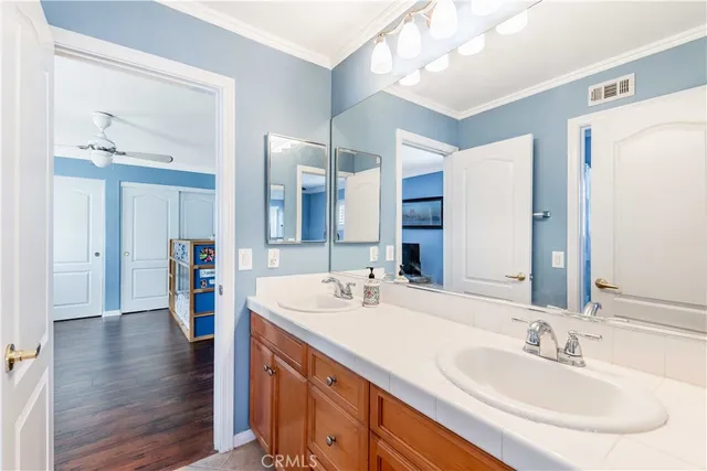 a bathroom with a toilet a sink and a window