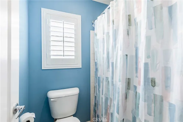 a view of room with toys and wooden floor