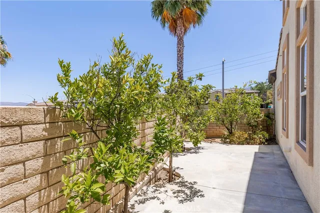 an aerial view of multiple houses with a swimming pool