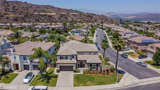 an aerial view of residential house and sandy dunes