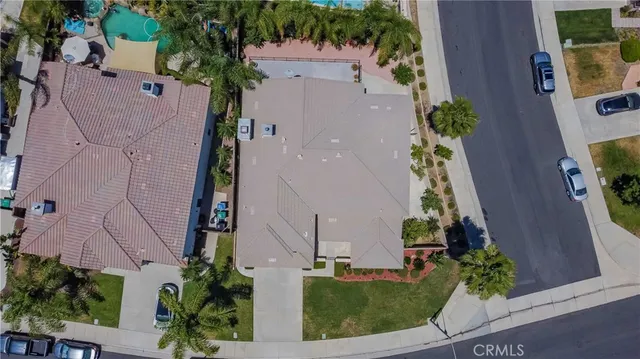 an aerial view of a house with a yard and garden