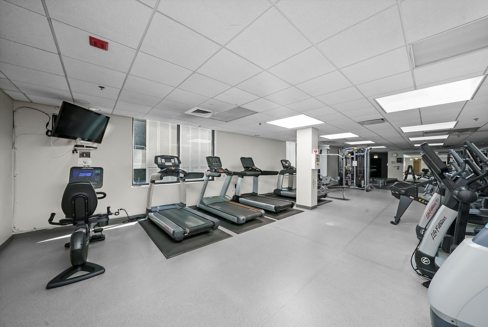 910 South Michigan Avenue, Unit 1612 Chicago, IL 60605 - Photo 15 of 17 a view of a room with gym equipment