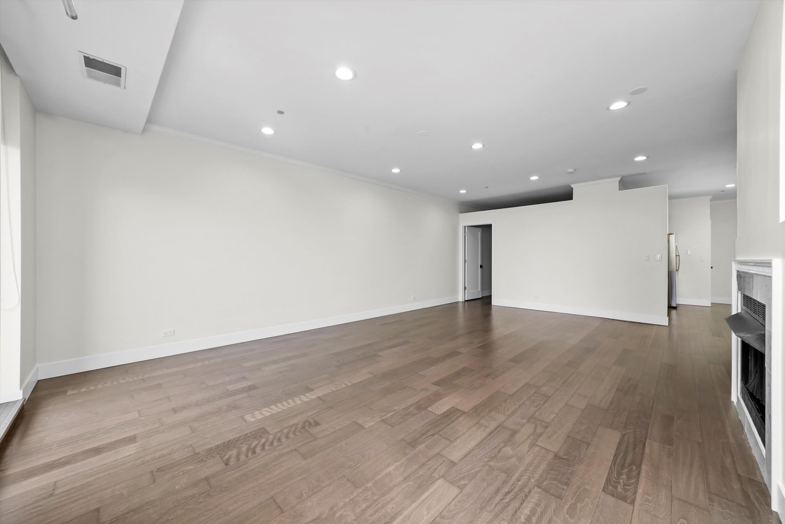 910 South Michigan Avenue, Unit 1612 Chicago, IL 60605 - Photo 4 of 17 a view of empty room with wooden floor
